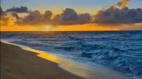 Sunset Over Ocean With Crashing Waves GIF