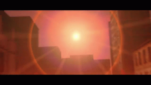 The Sun Is Shining Brightly Over A City With Buildings In The Foreground . GIF