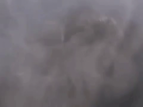 The Sun Is Shining Through The Clouds And Smoke Is Coming Out Of Them GIF