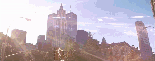 The Sun Is Shining Through The Windows Of A City Skyscraper GIF