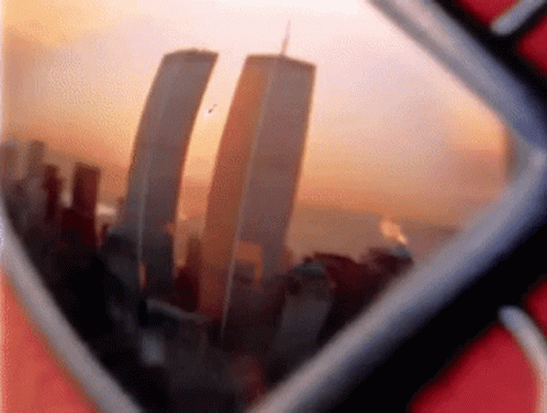 The Twin Towers Are Reflected In A Pair Of Glasses GIF
