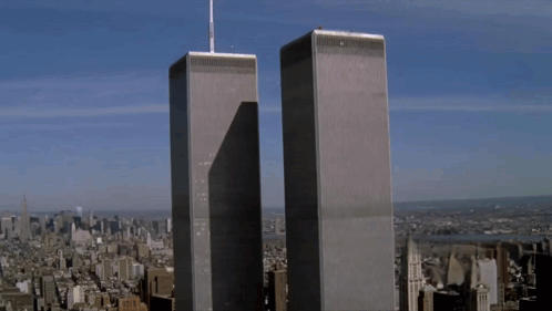 The Twin Towers Of The World Trade Center Are Shown GIF