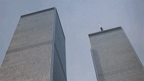 The Twin Towers Of The World Trade Center Are Shown From Below GIF
