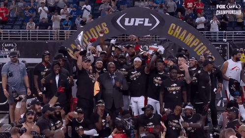The Ufl Champions Are Celebrating In Front Of A Crowd GIF