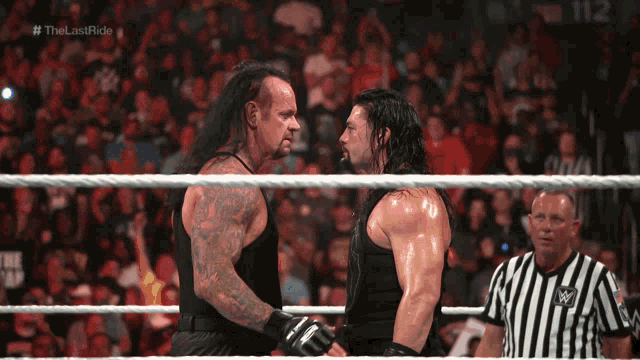 The Undertaker Tapping Opponent Chest GIF