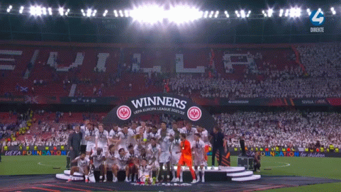 The Winners Of The Uefa Europa League Celebrate On A Stage GIF