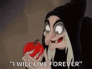 The Witch From Snow White And The Seven Dwarfs Is Holding A Red Apple In Her Hand And Saying `` I Will Live Forever '' . GIF