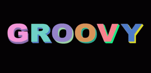 The Word Groovy Is Written In Colorful Letters Against A Black Background GIF
