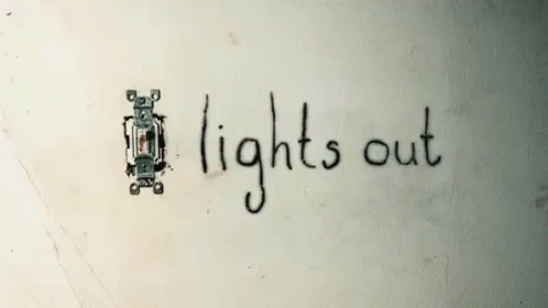 the word lights out is written on a wall