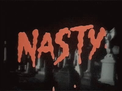 The Word Nasty Is Written In Red On A Black Background In A Cemetery . GIF