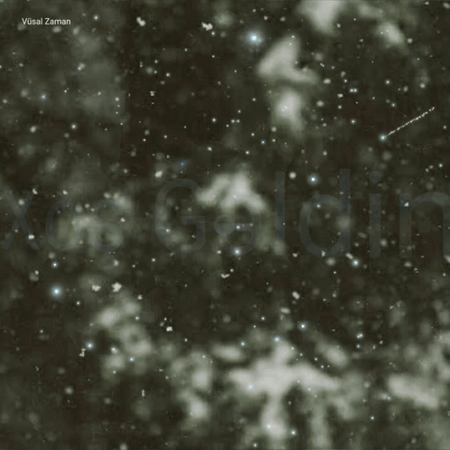 The Word Xos Is On A Dark Background With Snow GIF