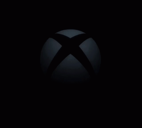 The Xbox Logo Is Glowing In The Dark With The Sun Shining Through It GIF