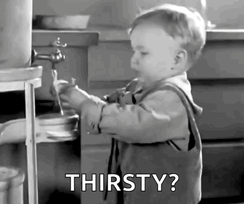 Thirsty Baby Drinking From Faucet