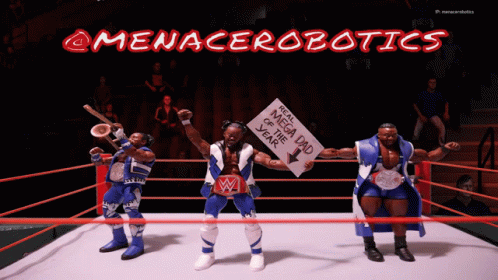 Three Action Figures In A Wrestling Ring With A Sign That Says Megadad Of The Year GIF