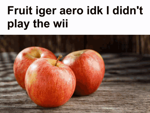 Three Apples On A Wooden Table With The Words Fruit Iger Aero Idk I Didn 'T Play The Wii GIF