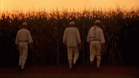 Three Baseball Players Walking Through Corn Field GIF