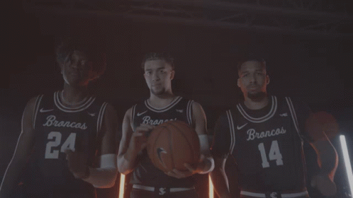 Three Basketball Players in Brancos Jerseys