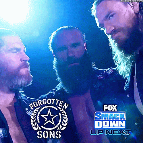 Three Bearded Men Are Standing Next To Each Other In Front Of A Fox Smack Down Sign GIF