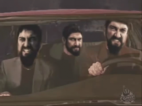 Three Bearded Men In A Car With Comix Logo GIF