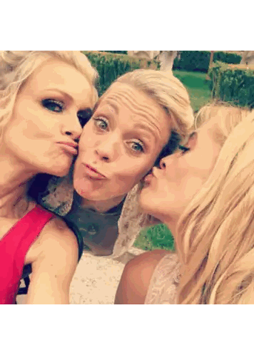 three blonde women are posing for a picture and making funny faces