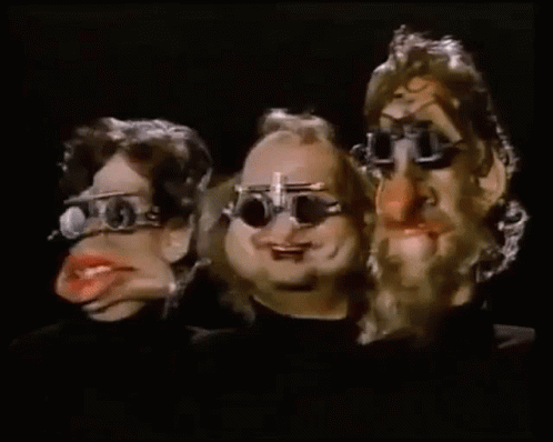 Three Cartoon Characters Wearing Glasses Are Standing Next To Each Other . GIF