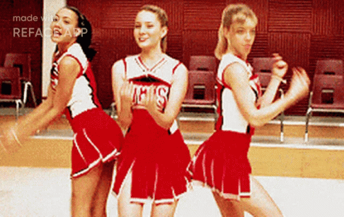 Three Cheerleaders In Red Uniforms GIF