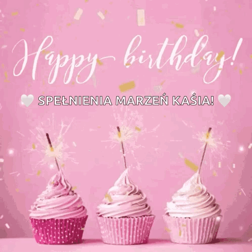 Three Cupcakes With Pink Frosting And Sparklers On A Pink Background GIF