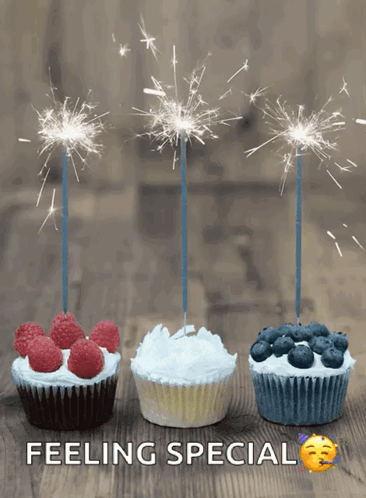 Three Cupcakes With Sparklers On Them And The Words Feeling Special GIF