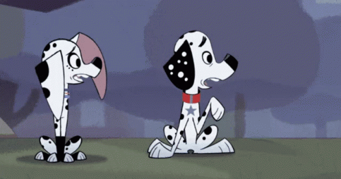 Three Dalmatian Dogs With One Having a Red White Blue Star on Collar