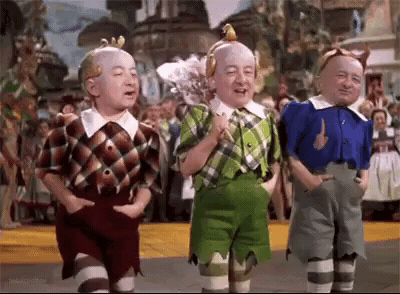 Three Dwarfs From The Wizard Of Oz Standing GIF
