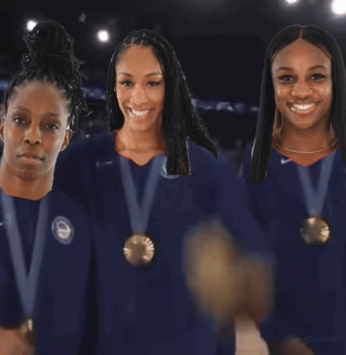Three Female Athletes Wearing Medals Are Standing Next To Each Other GIF