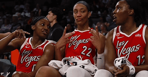 Three Female Basketball Players Wearing Red Jerseys With Las Vegas Written On Them GIF