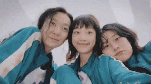 Three Girls Are Posing For A Picture With The Date 10 14 20 On The Bottom Right GIF