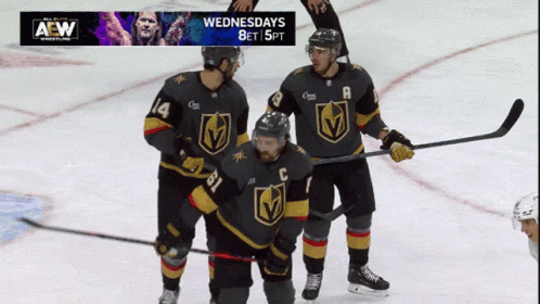 Three Hockey Players on Ice With AEW Advertisement