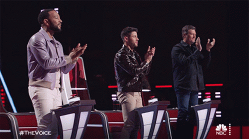 Three Men Applaud In Front Of A Screen That Says Nbc GIF