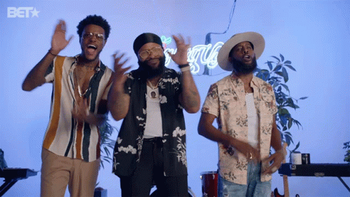 Three Men Are Singing In Front Of A Bet Sign GIF