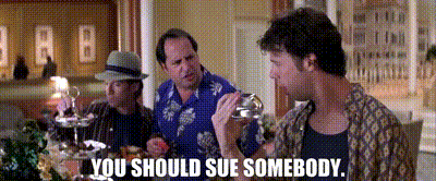 Three Men Are Sitting At A Table And One Of Them Is Holding A Glass And Says You Should Sue Somebody . GIF