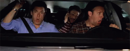 Three Men Are Sitting In A Car With Their Mouths Open And One Of Them Is Screaming . GIF