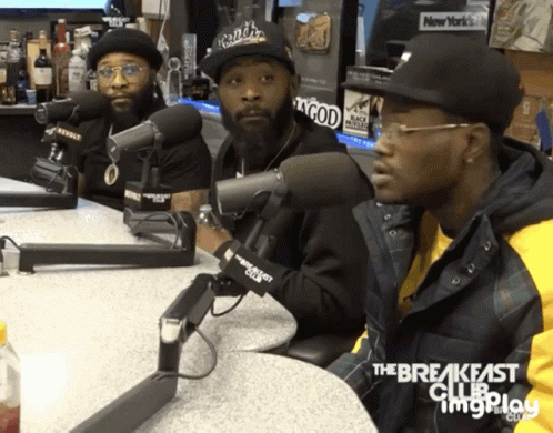 Three Men Are Sitting In Front Of Microphones With The Breakfast Club Written On The Bottom Right GIF