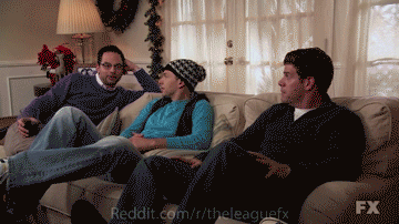 Three Men Are Sitting On A Couch With Reddit.com/r/theleaguefx In The Upper Right Corner GIF