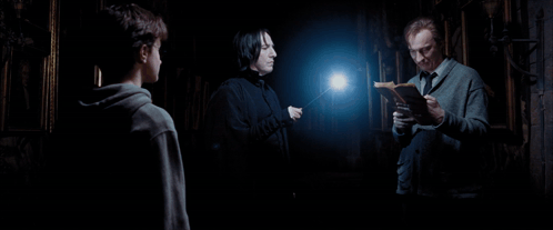 Three Men Are Standing In A Dark Room With The Words Honestly On The Bottom Right GIF