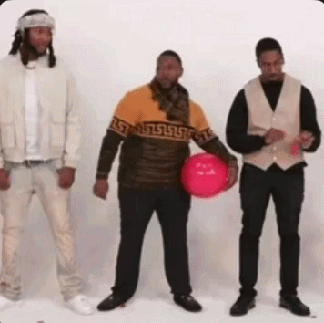 Three Men Are Standing Next To Each Other And One Of Them Is Holding A Red Ball . GIF