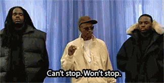 Three Men Are Standing Next To Each Other In Front Of A Blue Curtain . GIF