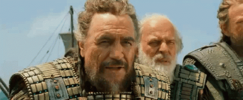 Three Men Are Standing Next To Each Other On A Boat . GIF