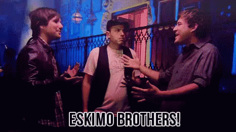 Three Men Are Standing Next To Each Other With The Words Eskimo Brothers Written On The Bottom GIF