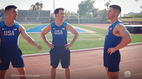 Three Men Are Standing On A Track Wearing Usa Shirts GIF