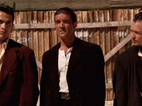 Three Men At Wooden Fence One In Black Jacket GIF