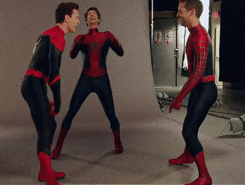 Three Men Dressed In Spiderman Costumes Are Laughing Together GIF