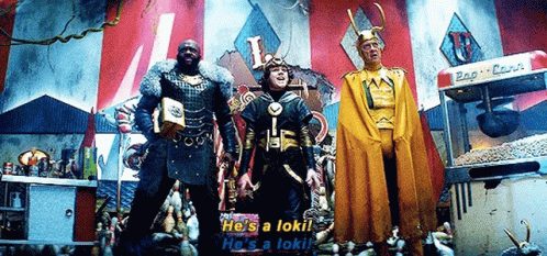 Three Men In Costumes Are Standing Next To Each Other In Front Of A Popcorn Machine In A Carnival . GIF
