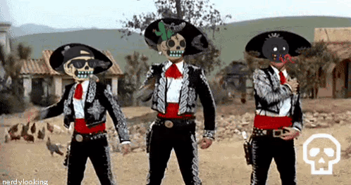 Three Men In Day Of The Dead Costume Are Dancing In A Desert . GIF